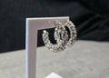 Boucles d'oreilles type petite créole orné de strass argentés