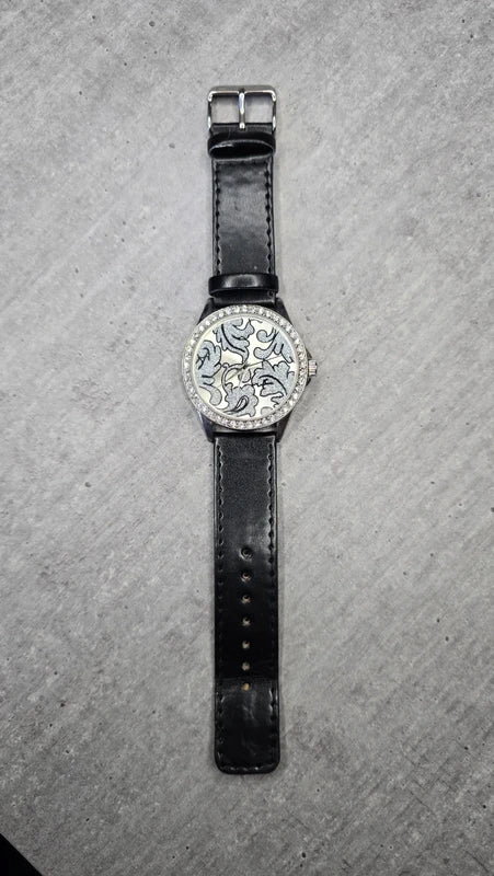Montre vintage - femme - noir simili cuir - cadran strass argenté motif paillettes - élégant chic