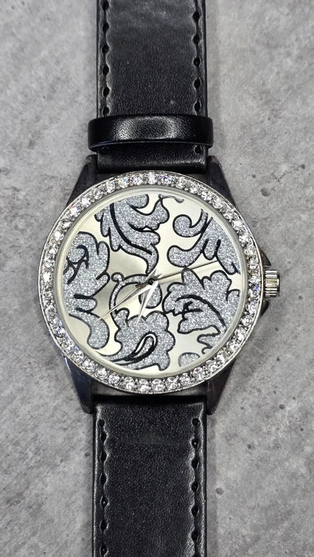 Montre vintage - femme - noir simili cuir - cadran strass argenté motif paillettes - élégant chic