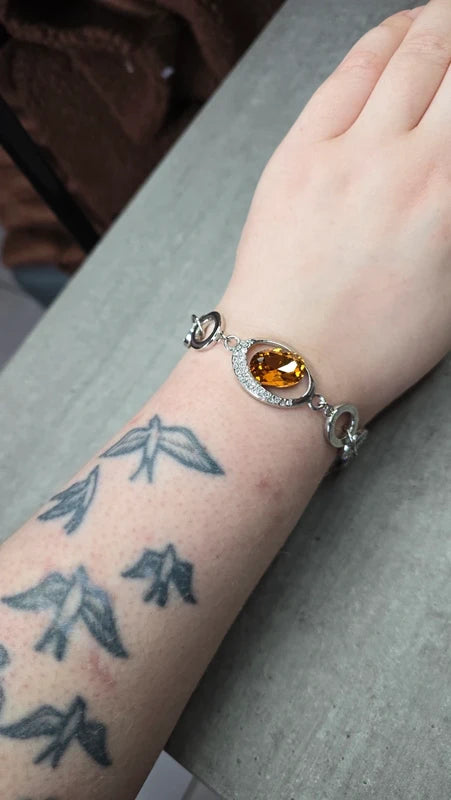 bracelet vintage - neuf - pierre facette effet ambre orange - strass argenté - cercle brillant - chic élégant - acier inoxydable