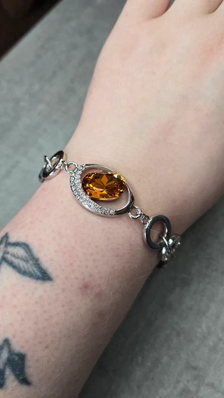 bracelet vintage - neuf - pierre facette effet ambre orange - strass argenté - cercle brillant - chic élégant - acier inoxydable