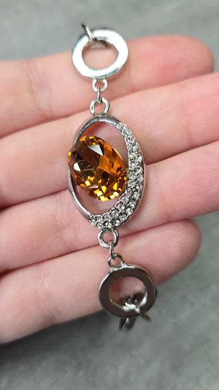 bracelet vintage - neuf - pierre facette effet ambre orange - strass argenté - cercle brillant - chic élégant - acier inoxydable