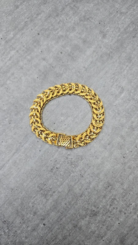 bracelet vintage - neuf - effet gourmette - acier inoxydable doré - motif ajouré travaillé maille - style rétro - chic