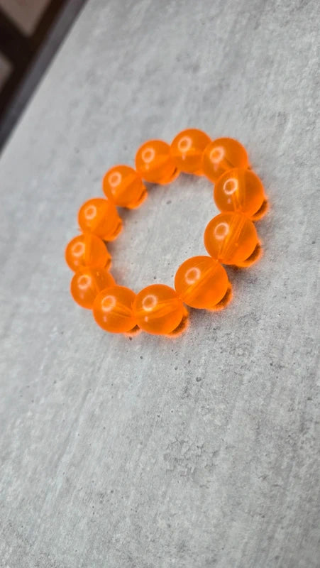bracelet vintage - neuf - élastique - grosse perles rondes orange translucide - style rétro pop