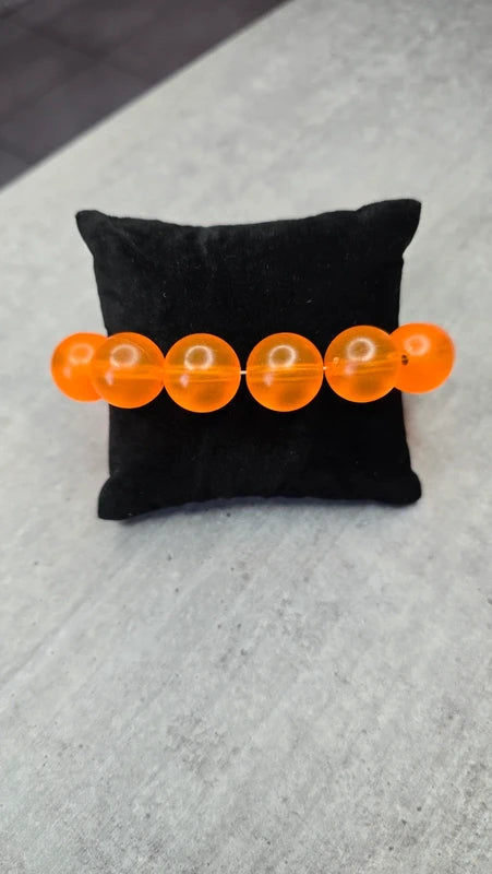 bracelet vintage - neuf - élastique - grosse perles rondes orange translucide - style rétro pop
