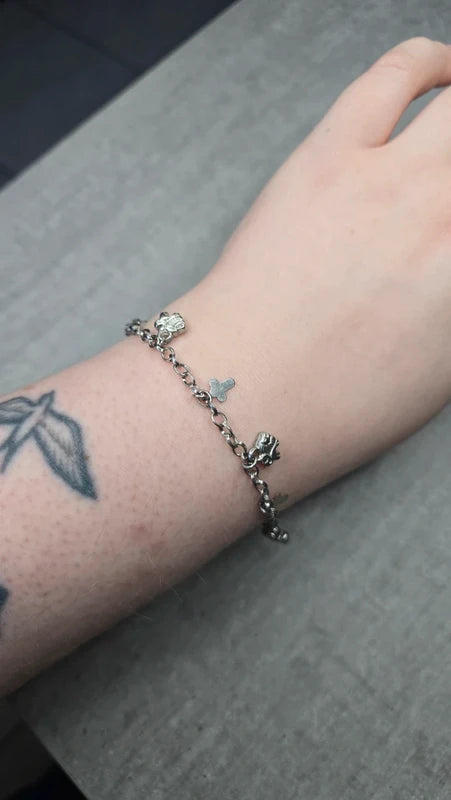 bracelet vintage - neuf - chaine argenté effet mat - charms breloque pendentif croix lion - élégant - clochette