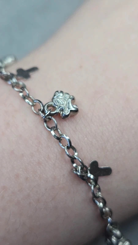 bracelet vintage - neuf - chaine argenté effet mat - charms breloque pendentif croix lion - élégant - clochette