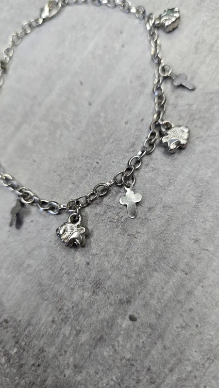 bracelet vintage - neuf - chaine argenté effet mat - charms breloque pendentif croix lion - élégant - clochette