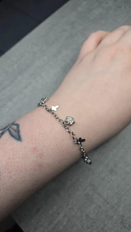 bracelet vintage - neuf - chaine argenté effet mat - charms breloque pendentif croix lion - élégant - clochette